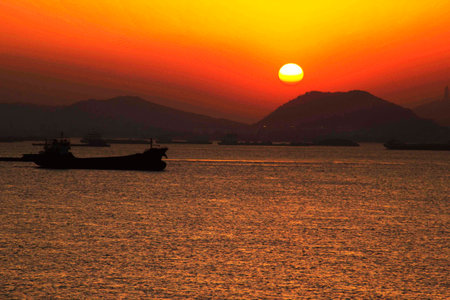 When the River in the morning sun, in the mountains there, is slowly rising. Start a new day, and leads a happy and good life.の写真素材