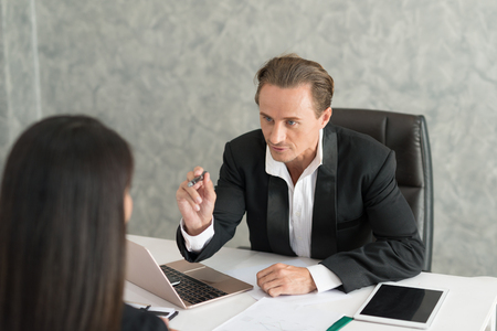 Boss complain to businesswoman employee for mistake on her job,  team leader dissatisfie with reportの写真素材