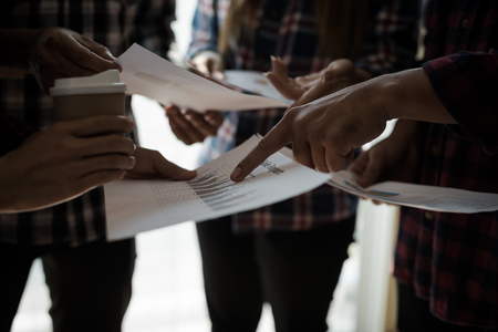 A group of people working man and woman in the plaid shirt Talking/consulting/idea about doing business. teamwork business meetingの写真素材