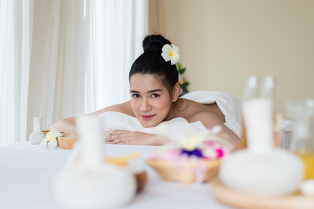 Beautiful Asian girl smile relaxing in the spa massage in salonの写真素材