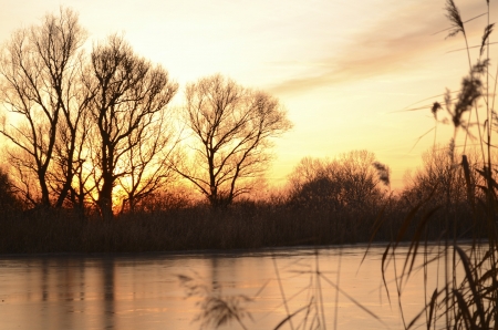 sunset over an icy lakeの写真素材