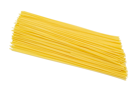 A Pile of Raw Traditional Spaghetti Isolated on Whiteの写真素材
