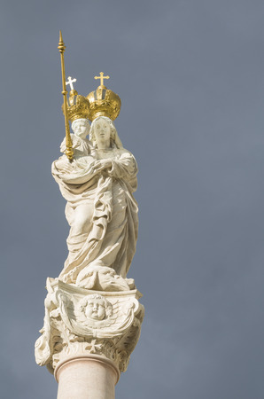 Statue of Virgin Mary and Baby Jesus with Golden Crowns Verticalの写真素材