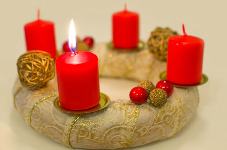 Lighted Golden Advent Wreath with Thick Red Candlesの写真素材