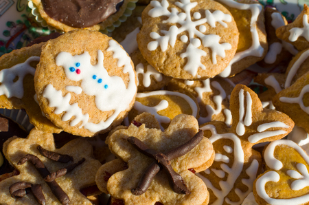 Different Types of Christmas Cookies with Snowman Snowflake Heart and Fish Decoration Closeupの写真素材