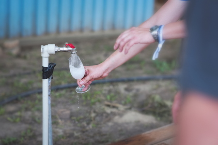 Washing Wine Glass at Wine Festival Outdoor Tapの写真素材
