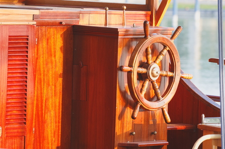 Classic Old Brown Wooden Ship Steering Wheelの写真素材