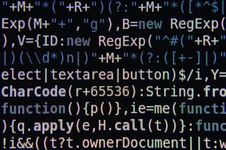 Blue and White Program Source Code Segment on Black Screen Closeupの写真素材