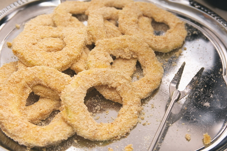 Raw Breaded Zucchini Rings on Silver Plate