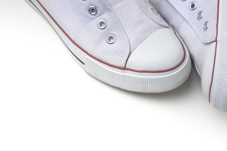 Pair of White Laceless Sneakers Isolated on White Backgroundの写真素材