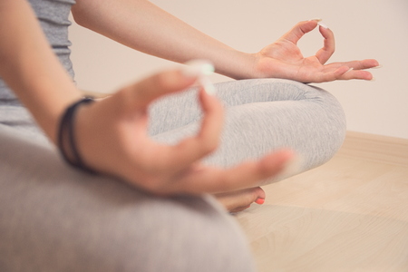 Teen Girl Meditating in Turkish Sitting Position Closeupの写真素材