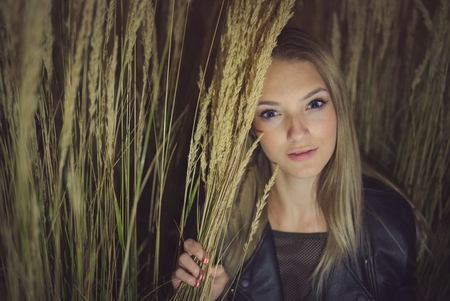 Teen Girl Night Portrait in Long Grassの写真素材