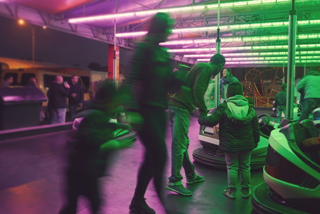People Selecting Bumper Cars at Town Fairの写真素材