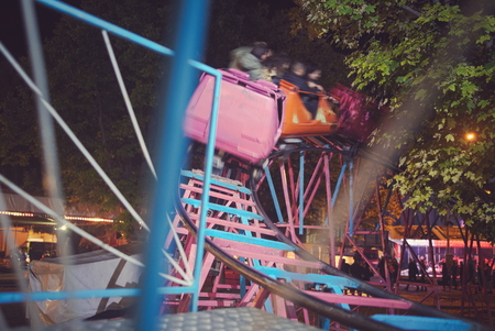 Fast Moving Roller Coaster at Town Fairの写真素材