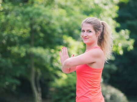 Woman in her Thirties Doing Yoga in the Park on a Summer Dayの写真素材