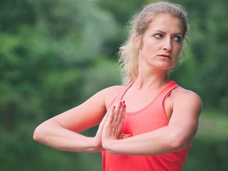 Woman in her Thirties Doing Yoga in the Park Closeupの写真素材