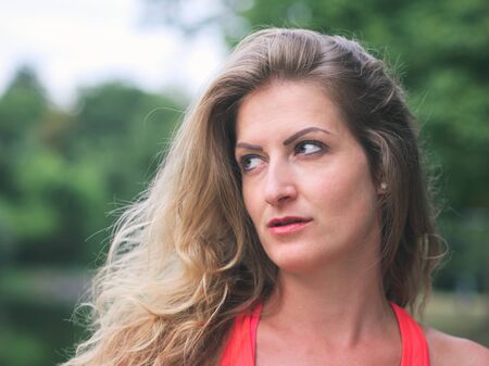 Portrait of a Sporty Woman in her Thirties in the Parkの写真素材