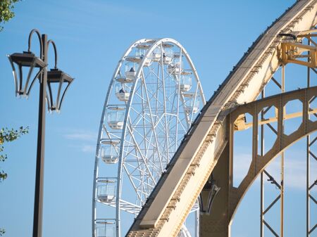 Ferris Wheel and Kossuth Bridge on a Sunny Autumn Day in GyÅr, Hungaryの写真素材