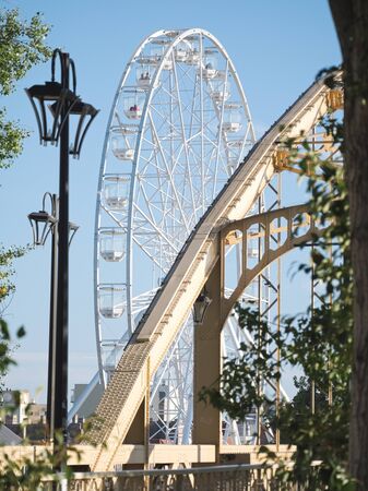 Ferris Wheel and Kossuth Bridge on a Sunny Autumn Day in GyÅr, Hungaryの写真素材