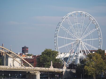 Ferris Wheel at Kossuth Bridge on a Sunny Autumn Day in GyÅr, Hungaryの写真素材