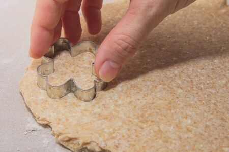 Cutting Cottage Cheese Dough with Four-leaf Clover Shaped Formの写真素材