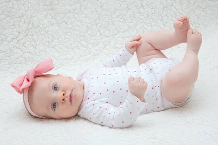 Adorable Baby Girl with Pink Hair Band Posing on Photoshoot