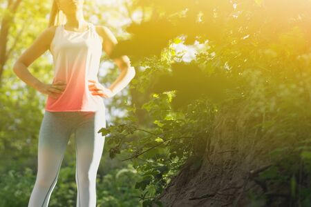 Young Blonde Caucasian Female Forest Runner Posing Conceptの写真素材