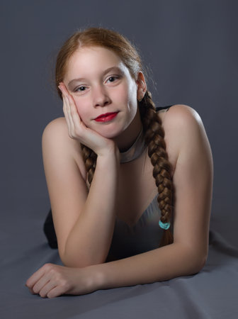 Redhead Teen Majorette Girl with Pigtails Posing in Studioの写真素材
