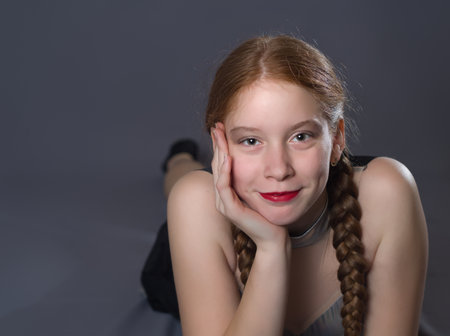 Redhead Teen Majorette Girl with Pigtails Posing in Studioの写真素材