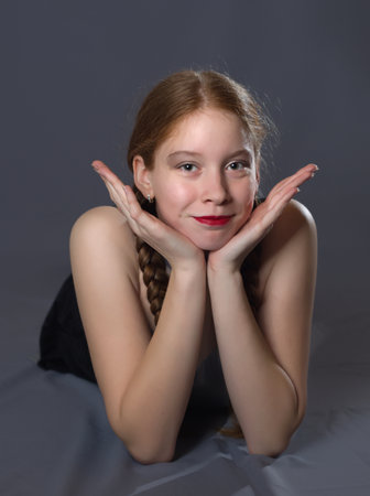 Redhead Teen Majorette Girl with Pigtails Posing in Studioの写真素材