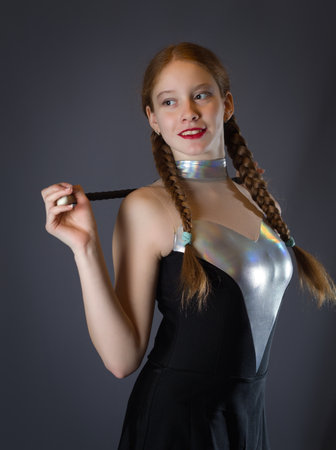 Redhead Teen Majorette Girl with Pigtails Posing in Studioの写真素材