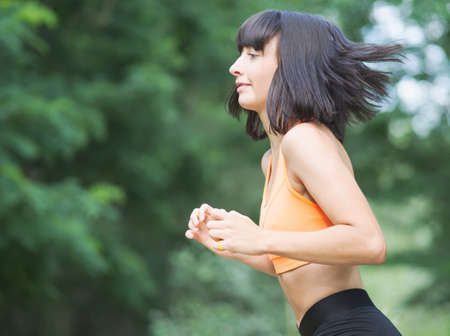 Pretty Young Skinny Woman Doing Exercises Outdoorsの写真素材