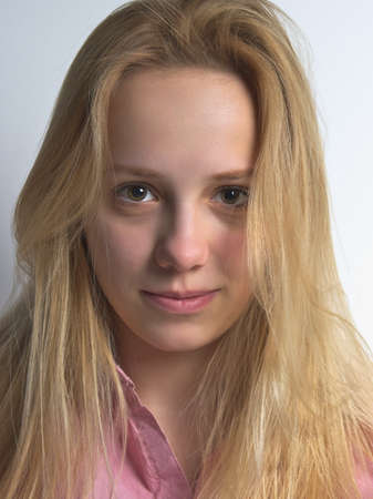 Portrait of a Beautiful Blonde Girl on White Background