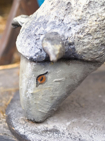 Grazing Gray Sheep Sculpture Head Closeup Verticalの写真素材