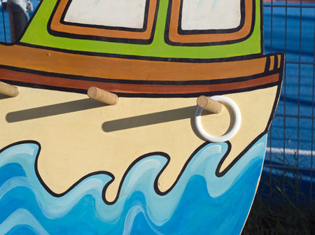 Closeup of an old-fashioned, wooden ring toss game. A fun outdoor activity full of skill and precision to challenge your friends in a competitive yet entertaining atmosphere!の写真素材