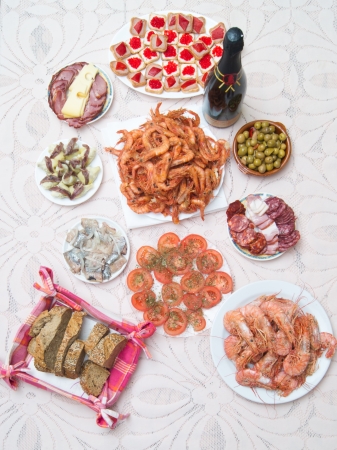 Plates on the table with foods and drinkの写真素材