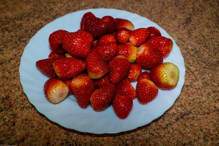 Plate with strawberries isolated on white background. Ripe strawberries close upの写真素材