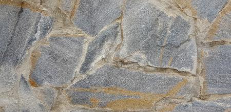 Stone wall rustic texture background. Textured stone wall closeup.の写真素材