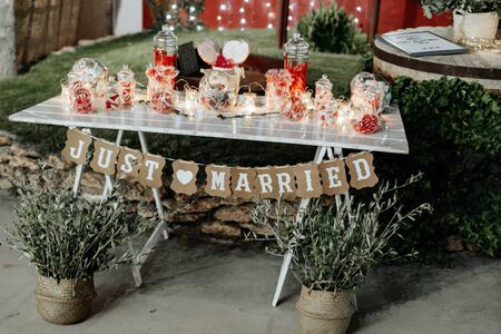 The inscription Just Married on cardboard stretched on a lace. The photo.