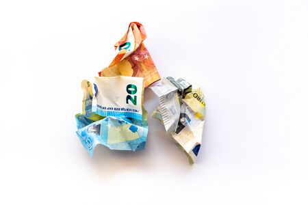 Crumpled euro money on a white background. Money trash. Money in the trash