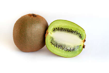 Kiwi fruit. Whole and half-sliced kiwi on a white background.の写真素材