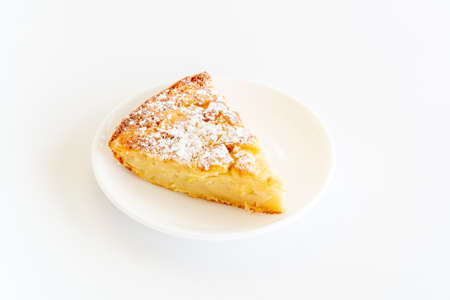 Isolated delicious apple pie charlotte on white background. Close up side view. Bake at home apple pie dessert. Recipe of homemade pastry.の写真素材