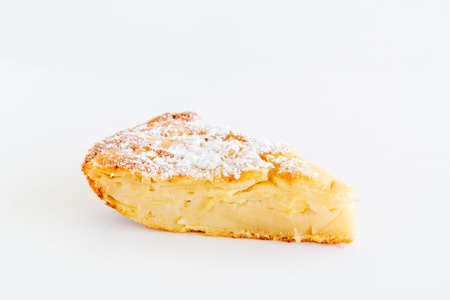 Isolated delicious apple pie charlotte on white background. Close up side view. Bake at home apple pie dessert. Recipe of homemade pastry.の写真素材