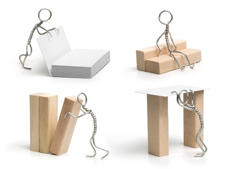 Wire man with the cards & wooden bricks. Over a white background. Set of 4.の写真素材