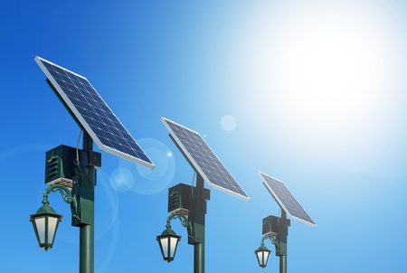 Solar photovoltaic powered lamp posts on the blue skies with sunの写真素材