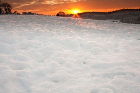 A snowy winter backdrop with lots of room for text.の写真素材