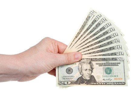 A hand holding $200 in $20 bills in a fan shape. 