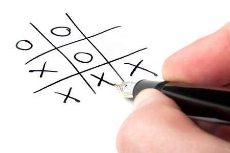 A male hand winning at tic-tac-toe.の写真素材