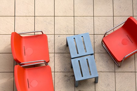 Some orange chairs in an outdoor seating area seen from above.の写真素材