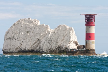 The lighthouse at the end of The Needles rocks on the Isle of Wight, Hampshire, UK.の写真素材
